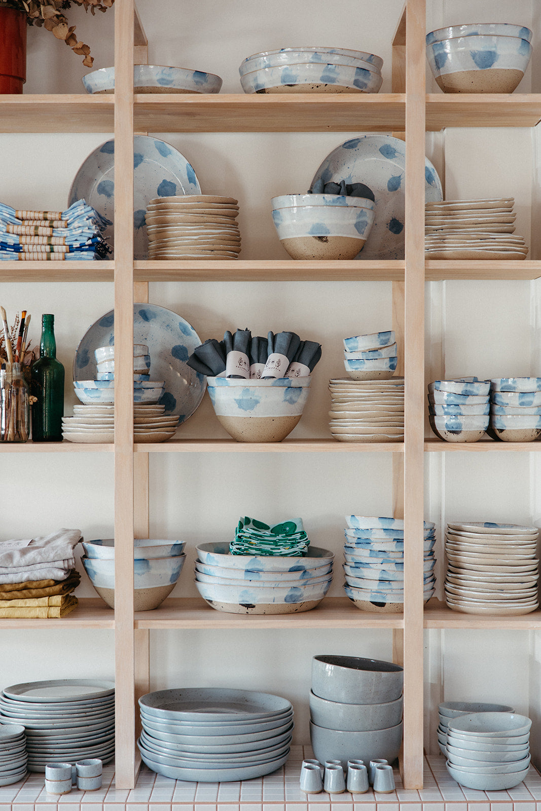 Shelf full of Palinopsia handmade ceramics on Darby Street in Newcastle