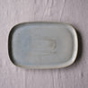 Handmade blue grey rectangle platter made from stoneware on a grey tablecloth by Palinopsia ceramics 