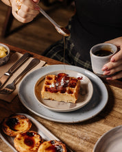 Brunch at Autumn Rooms Cafe serving golden waffles with bacon on speckled ceramic Maya Lunch plate by Palinopsia Ceramics