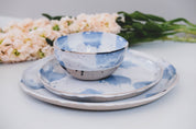 Three piece Pollock blue and white dinner set by Palinopsia Ceramics styled with wild flowers