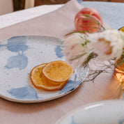 Handmade lunch plate by Palinopsia Ceramics in Blue and White glaze with abstract splashes of colour