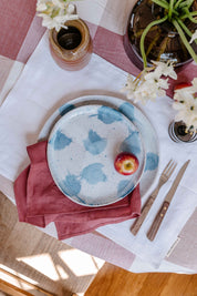 Dining table with handmade dinner set in blue and white by Palinopsia Ceramics
