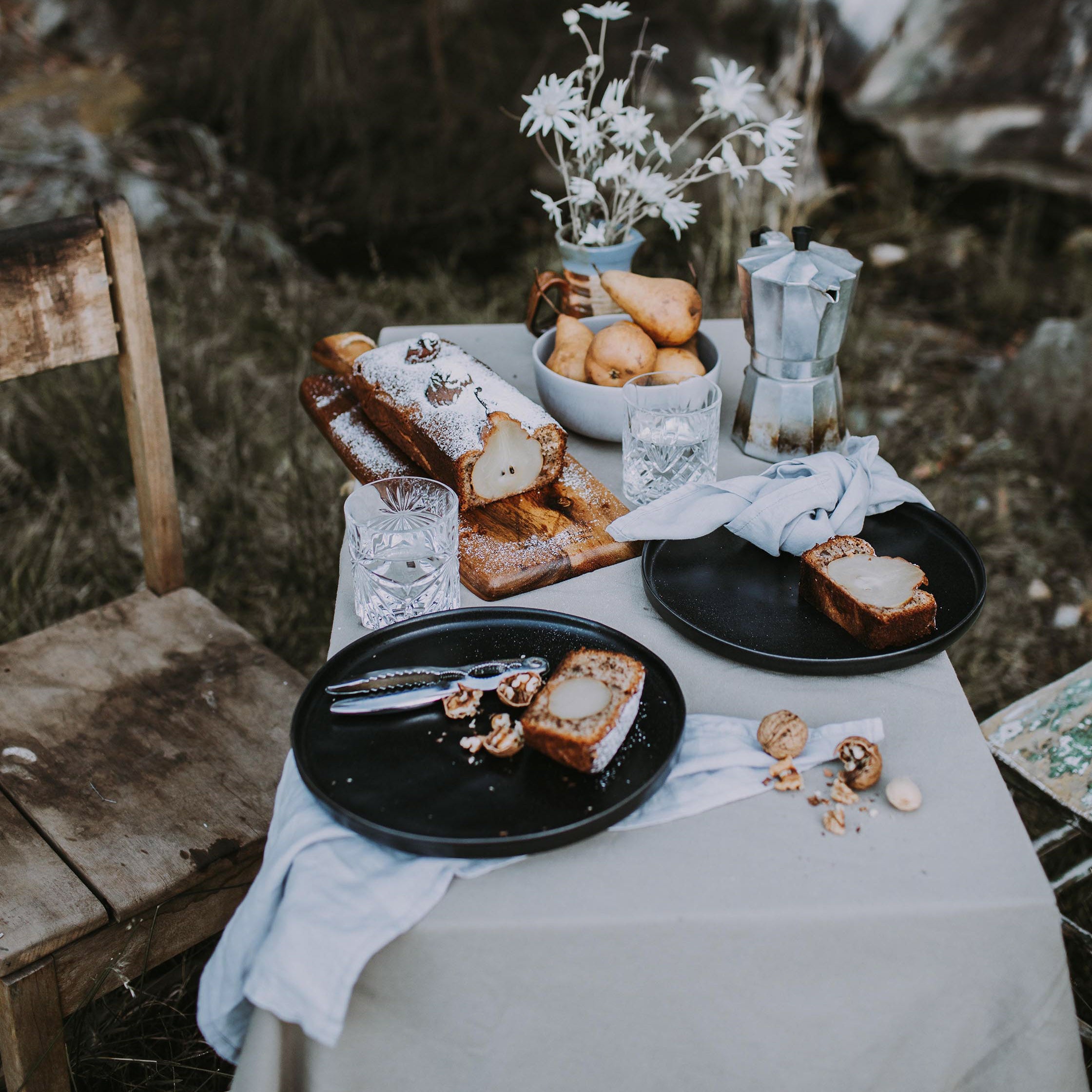 Australian Morning tea outdoors with gluten free pear cake served on Palinopsia Ceramics handmade dinner sets, black dinner plate and mushroom breakfast bowls