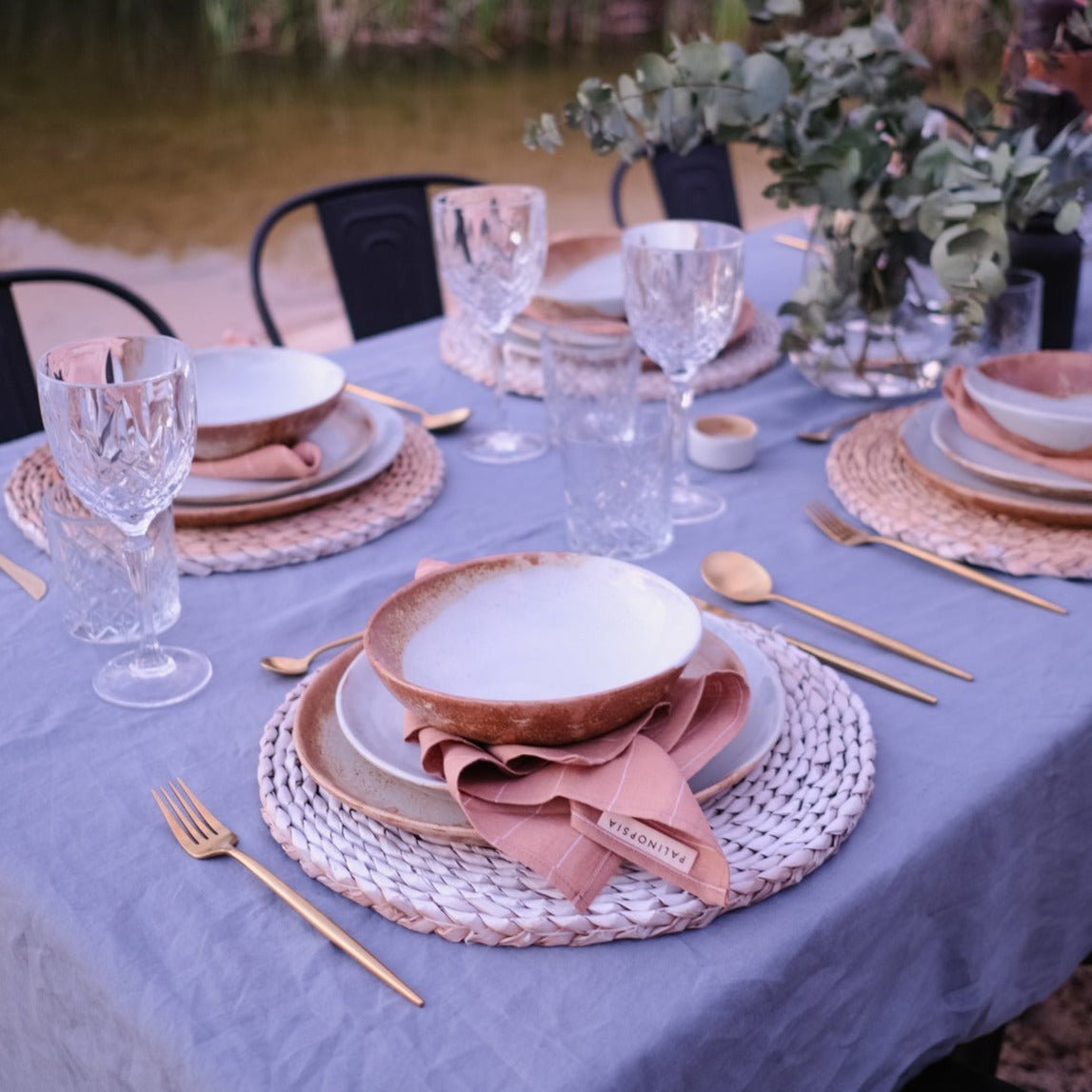 Outdoor dining table setting in rustic blues and browns  by Palinopsia Ceramics in Sydney