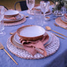 Outdoor table setting with vintage inspired dinnerware in blues and browns, dinner plate, lunch plate and soup bowl  
