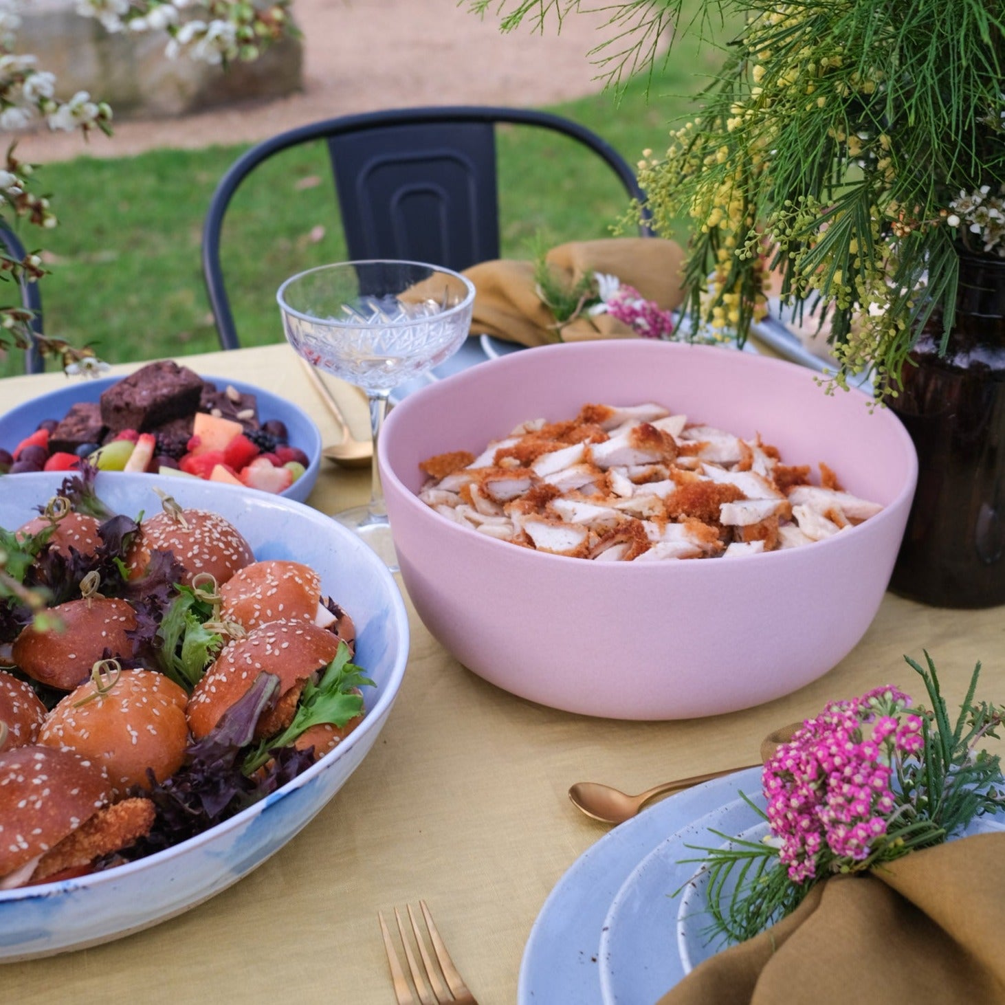 Handmade pink pottery bowl with a pasta salad by Palinopsia Ceramics