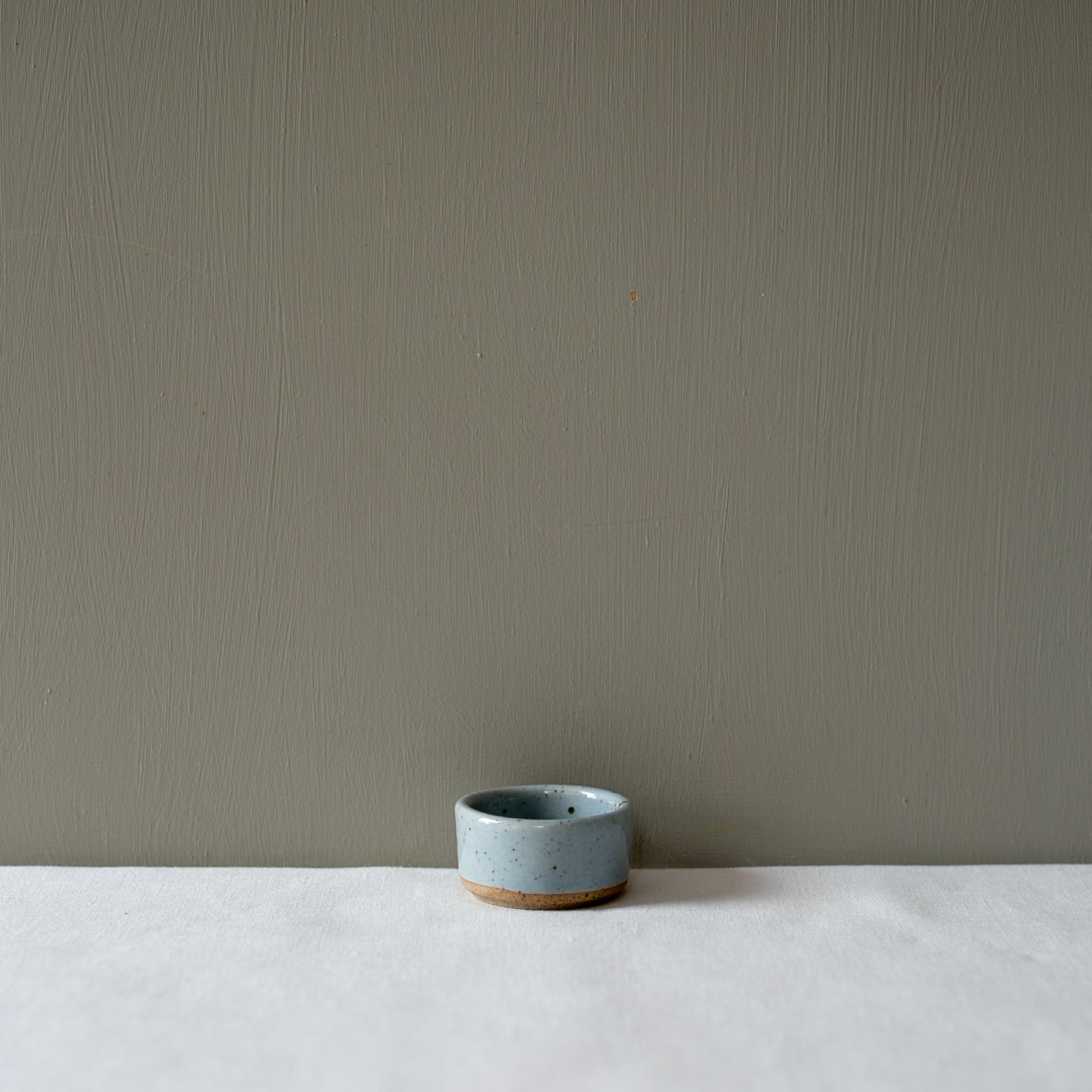 Side view of a small ramekin salt pinch bowl by Palinopsia Ceramicss