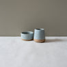 Small salt ramekin bowl and little sauce jug in blue grey