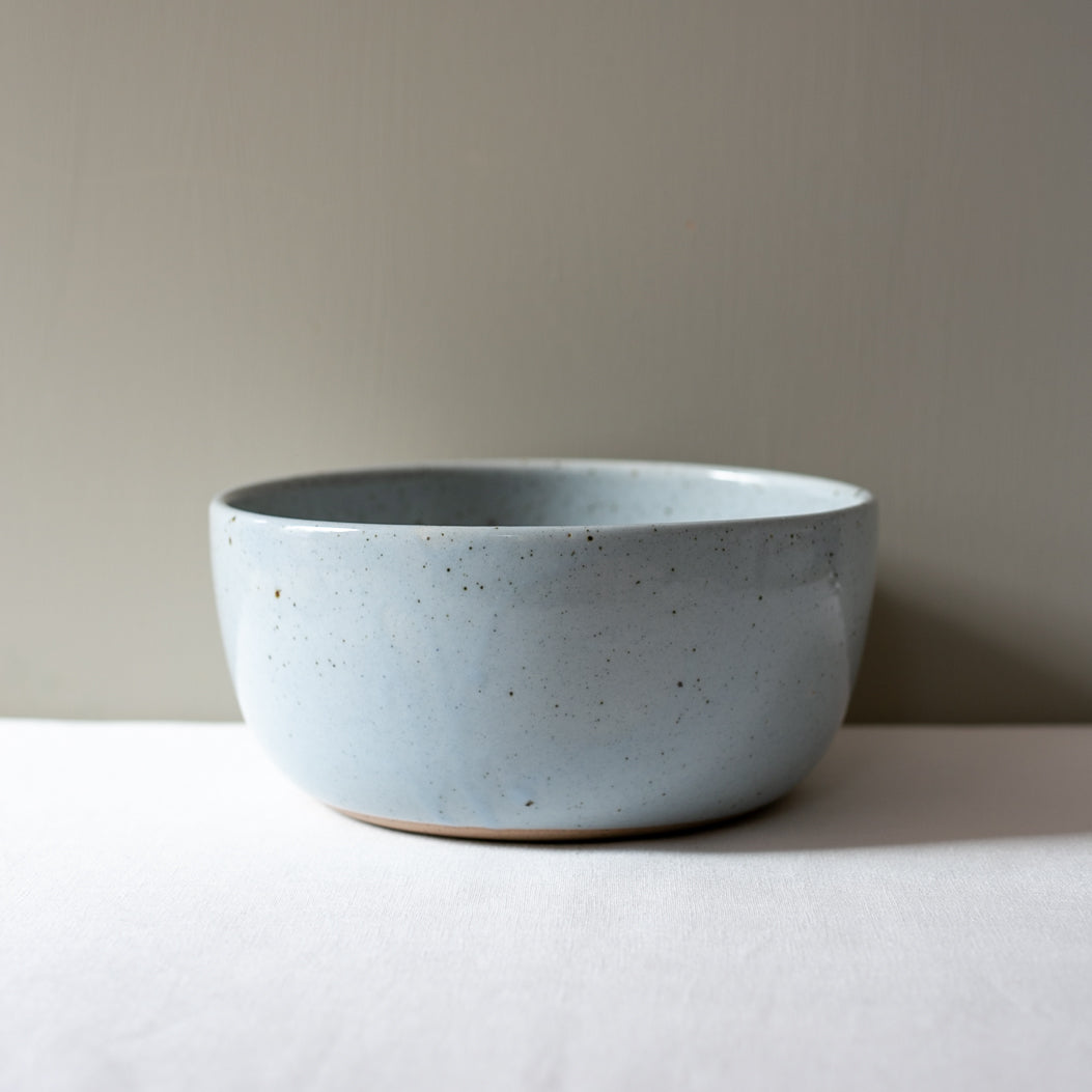 Side view of a salad bowl in blue and grey by Palinopsia Ceramics