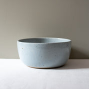 Side view of a salad bowl in blue and grey by Palinopsia Ceramics