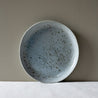 Handmade Maya lunch plate by Palinopsia leaning on a wall