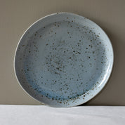 Large round handmade dinner plate classic shape in a blue grey colour with speckles