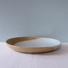 Side view of a large round serving platter handmade by Palinopsia Ceramics 