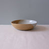 Side view of a brown and blue ceramic bowl by Palinopsia
