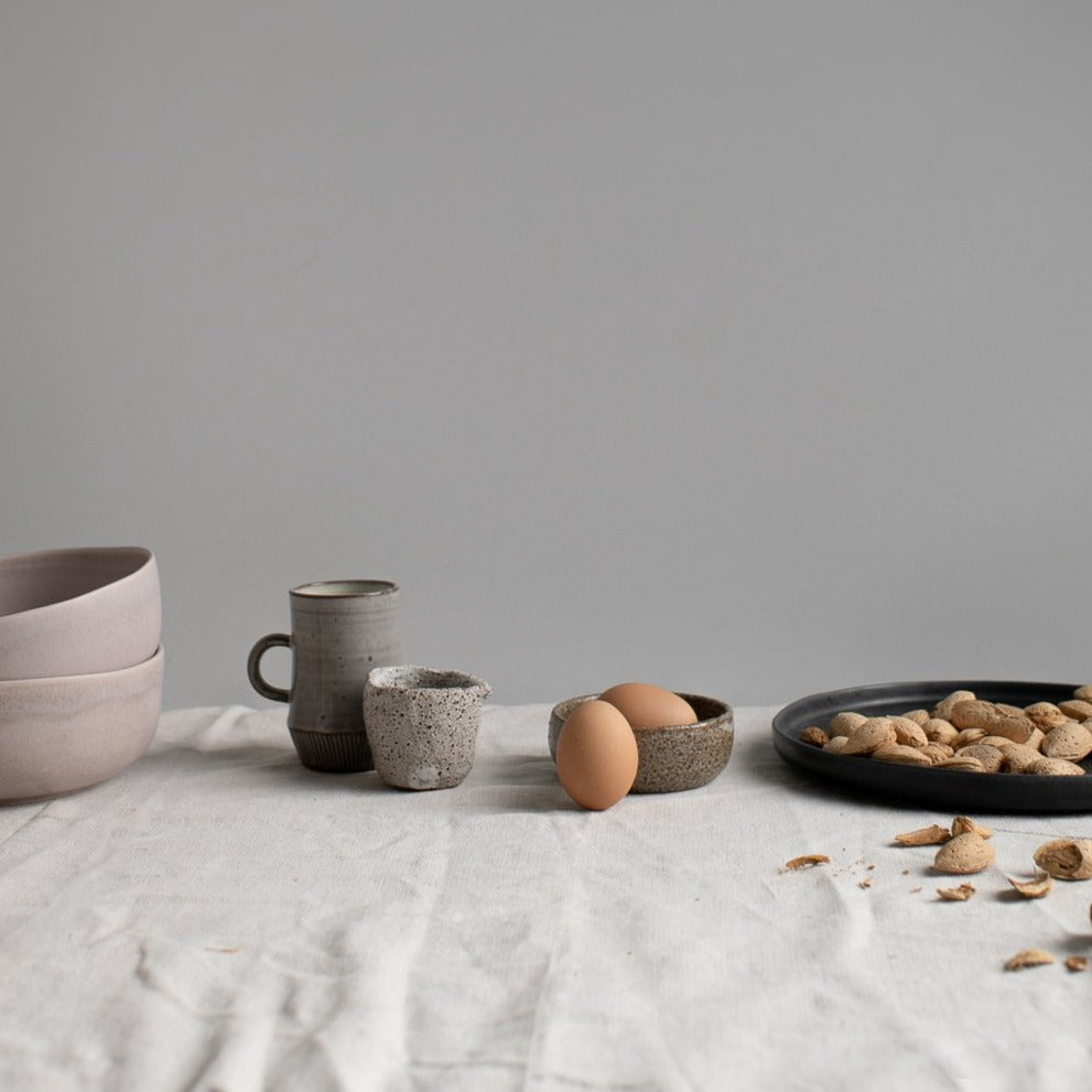 Palinopsia Dinner table with natural linen, handmade ceramics and in a still life inspired setting.