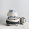 Stack of mixed handmade ceramic dinner sets by Palinopsia 