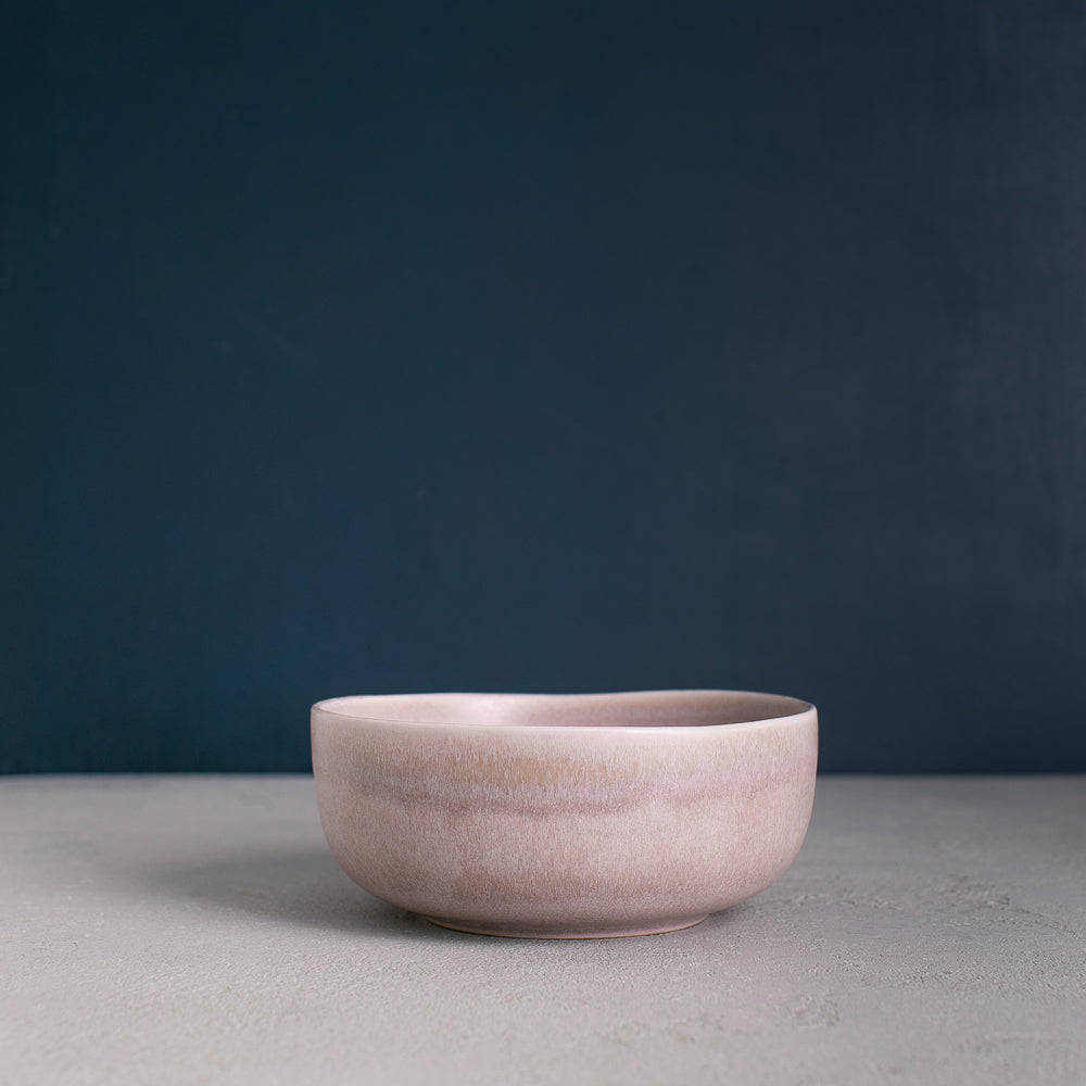 Sideview of a neutral grey handmade stoneware breakfast and soup bowl by Palinopsia Ceramics
