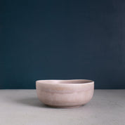 Sideview of a neutral grey handmade stoneware breakfast and soup bowl by Palinopsia Ceramics