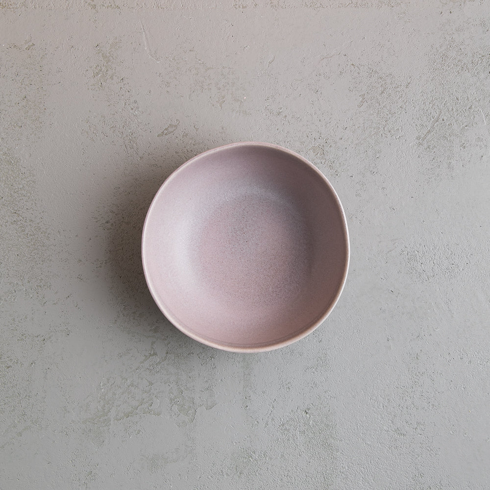 Bird's-eye view of a handmade grey soup and breakfast bowl by Palinopsia Ceramics
