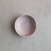 Bird's-eye view of a handmade grey soup and breakfast bowl by Palinopsia Ceramics
