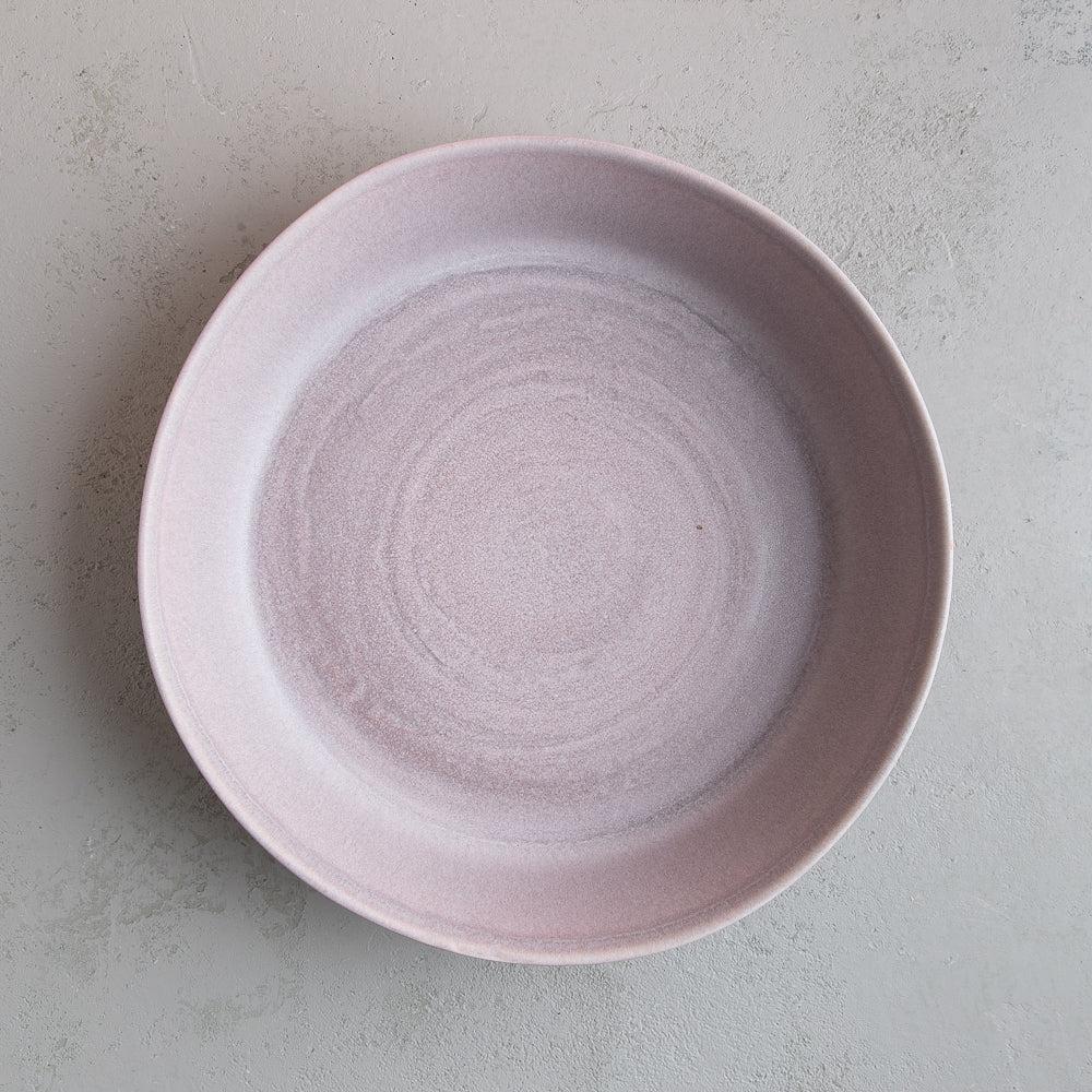 Birds eye view of Palinopsia Ceramics Handmade low salad and fruit bowl in neutral grey 