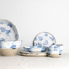 Handmade dinner set by Palinopsia ceramics in blue and white design against a white background