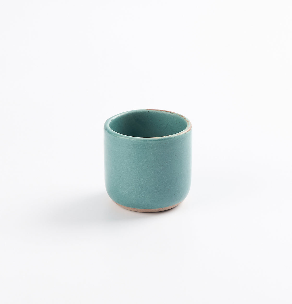 Antique teal blue green espresso cup on a white background 