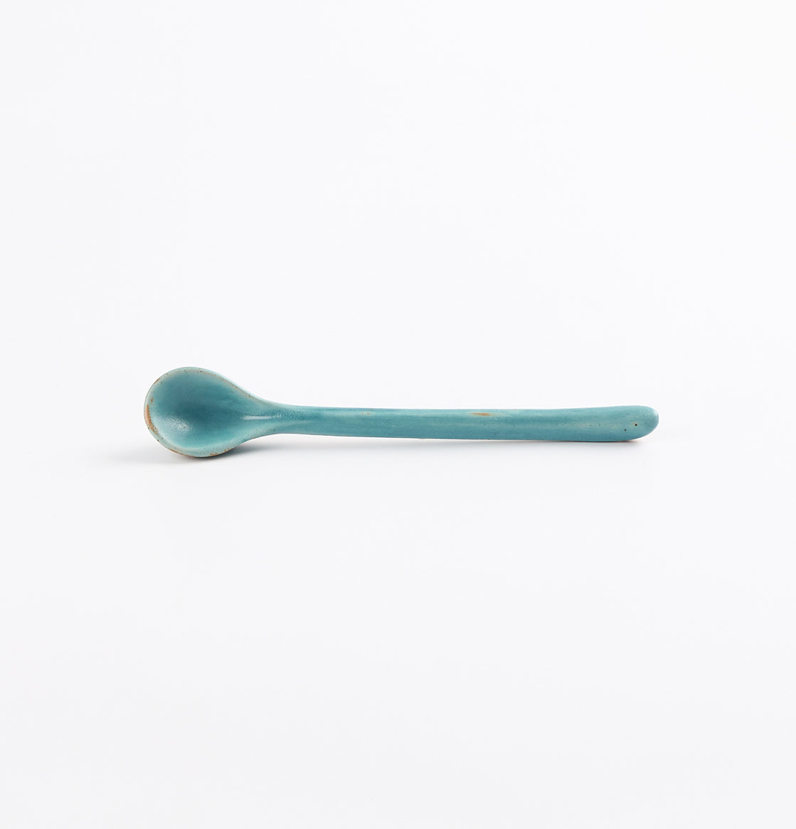 Antique teal blue and green teaspoon by Palinopsia Ceramics on a white background 