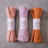 Colourful linen table napkins by Palinopsia Ceramics in pink salt, Jacaranda lilac and ginger