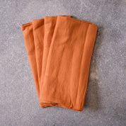 Four pack of Ginger coloured table napkins by Palinopsia Ceramics 