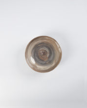 Ceramic bowl with a brown and gray gradient on a white background