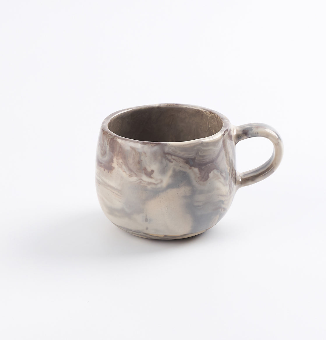 Four colour marbled ceramic mug on a white background by Palinopsia 