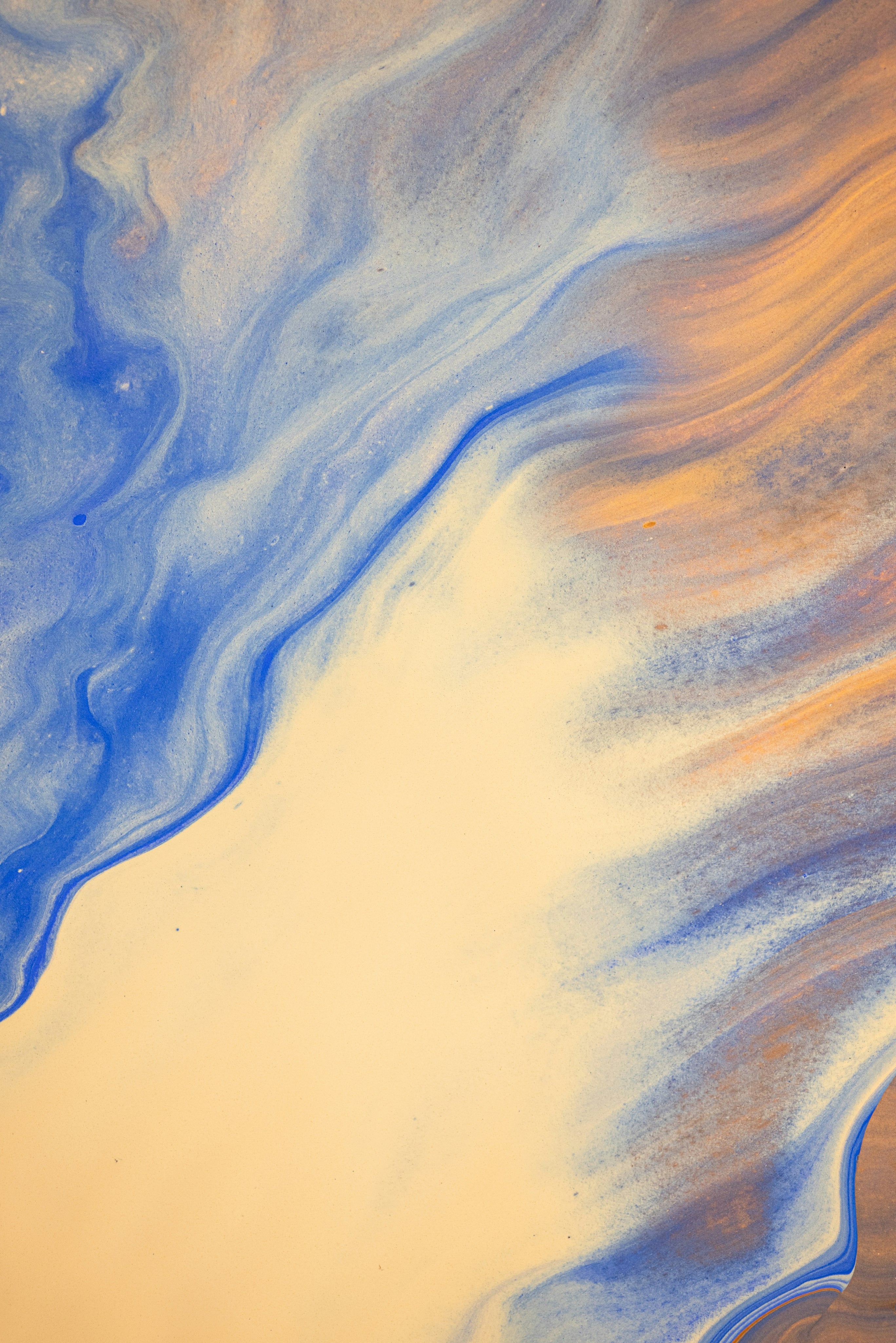 Abstract art with blue and orange colors on a beige background
