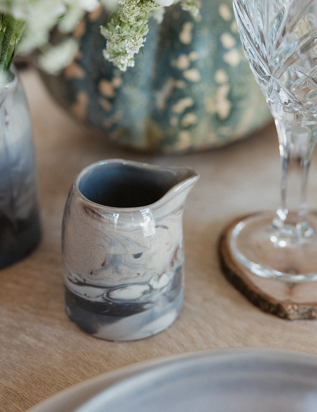Small marble pitcher on dinner table 