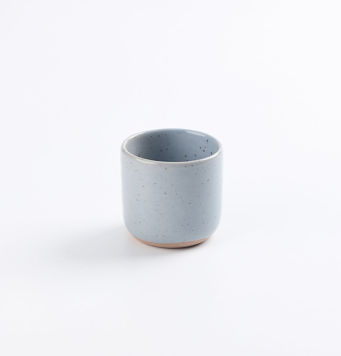 Blue ceramic espresso cup on a white background