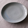 side view of a handmade extra large round serving platter 