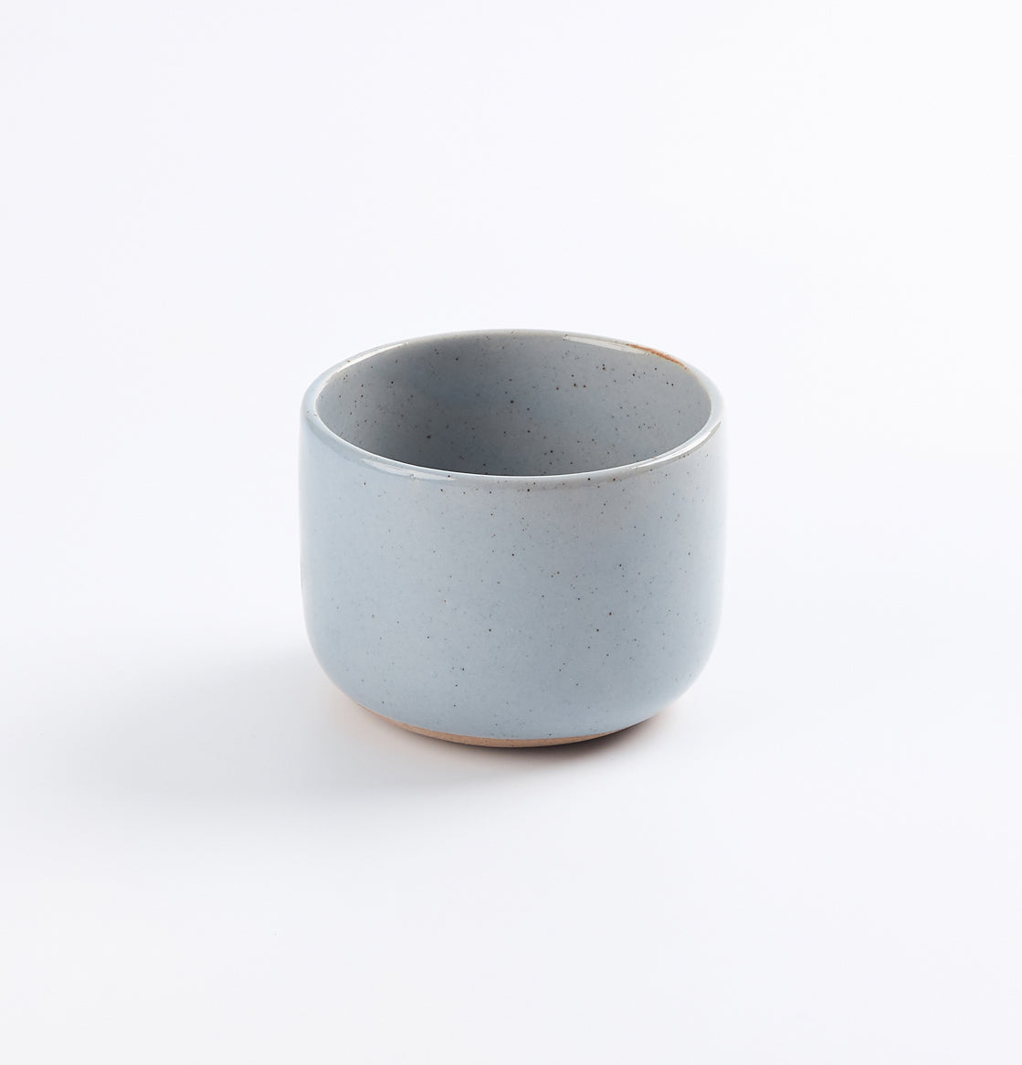 Light blue ceramic coffee cup on a white background