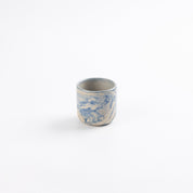 Ceramic espresso cup with marbled abstract design in cobalt blue and white by Palinopsia