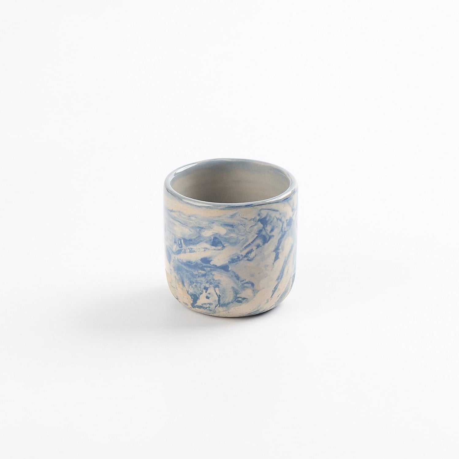 Ceramic espresso cup with marbled abstract design in cobalt blue and white by Palinopsia