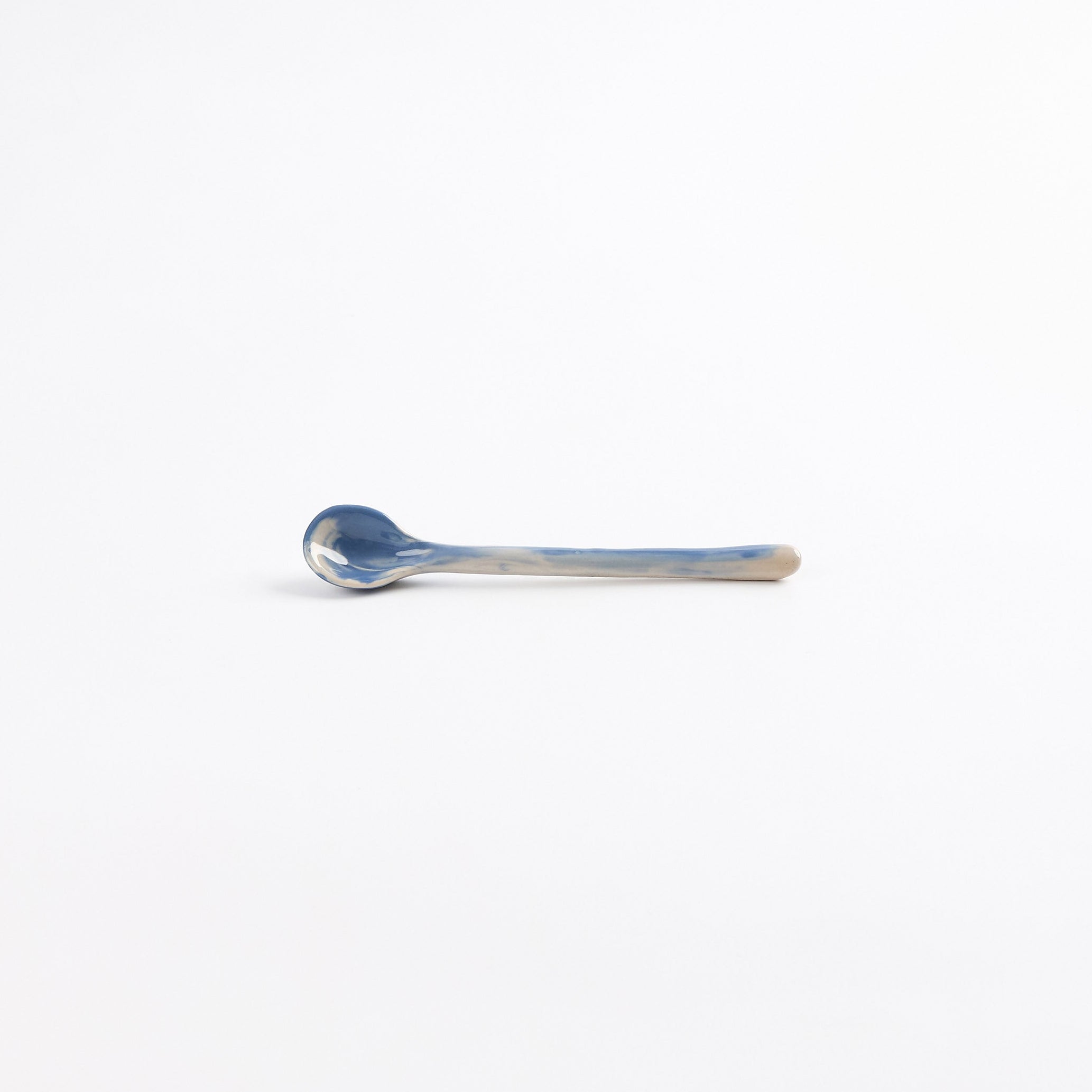 Ceramic teaspoon with marbled abstract design in cobalt blue and white by Palinopsia