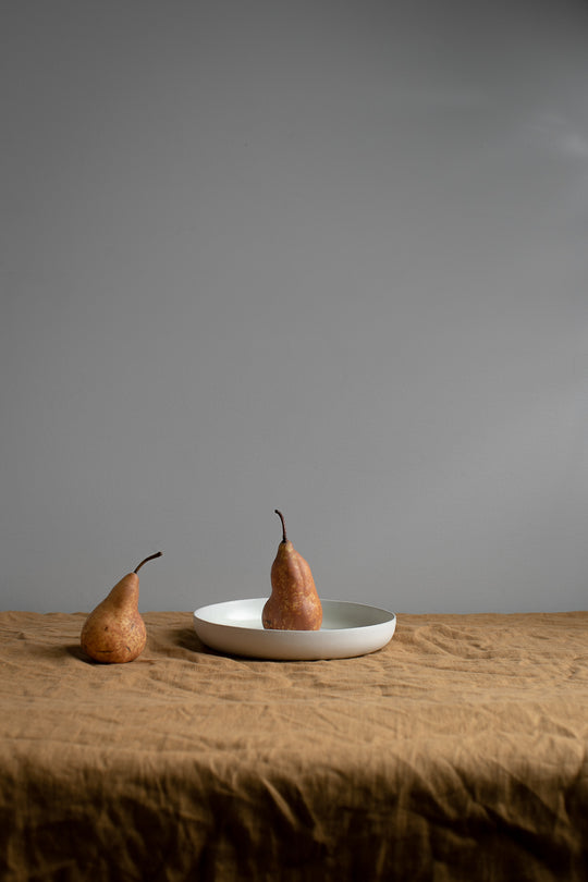 Food Photography Still Life inspired with pears, fruit and handmade Australian ceramics on natural linen tablecloth 