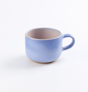 Baby blue mug with pink on white background 