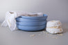 Stack of four blue pasta bowls with a Meringue and white table napkin by Palinopsia Ceramics