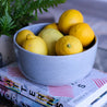 Handmade Palinopsia blue ceramic fruit bowl with lemons
