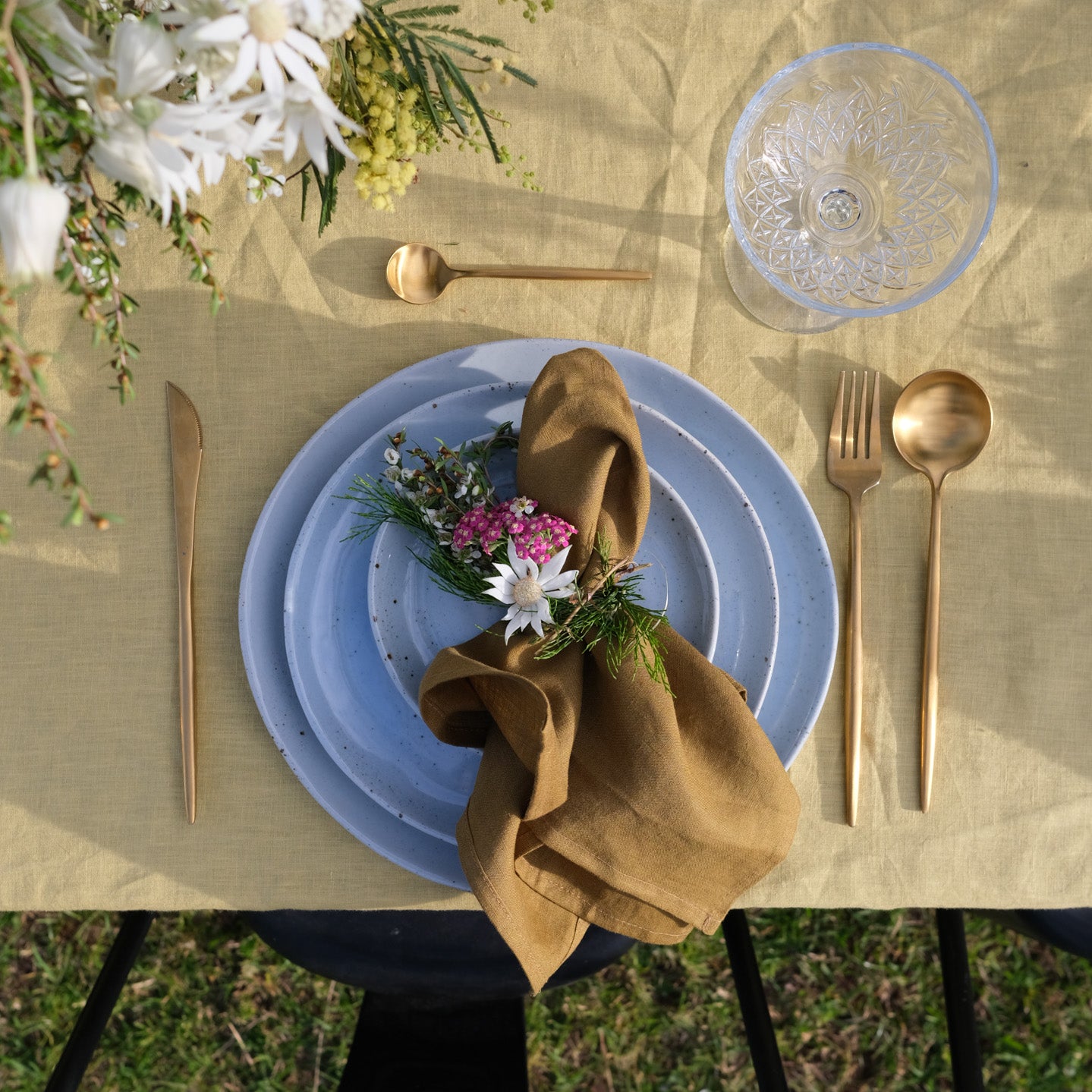Dinner set on outdoor summer table by Palinopsia Ceramics