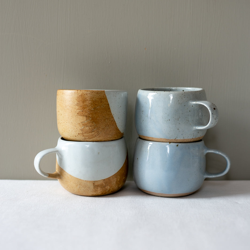 Stacked Palinopsia handmade coffee mugs and tea cups 