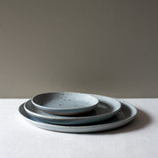 3 piece dinner set on a white tablecloth 