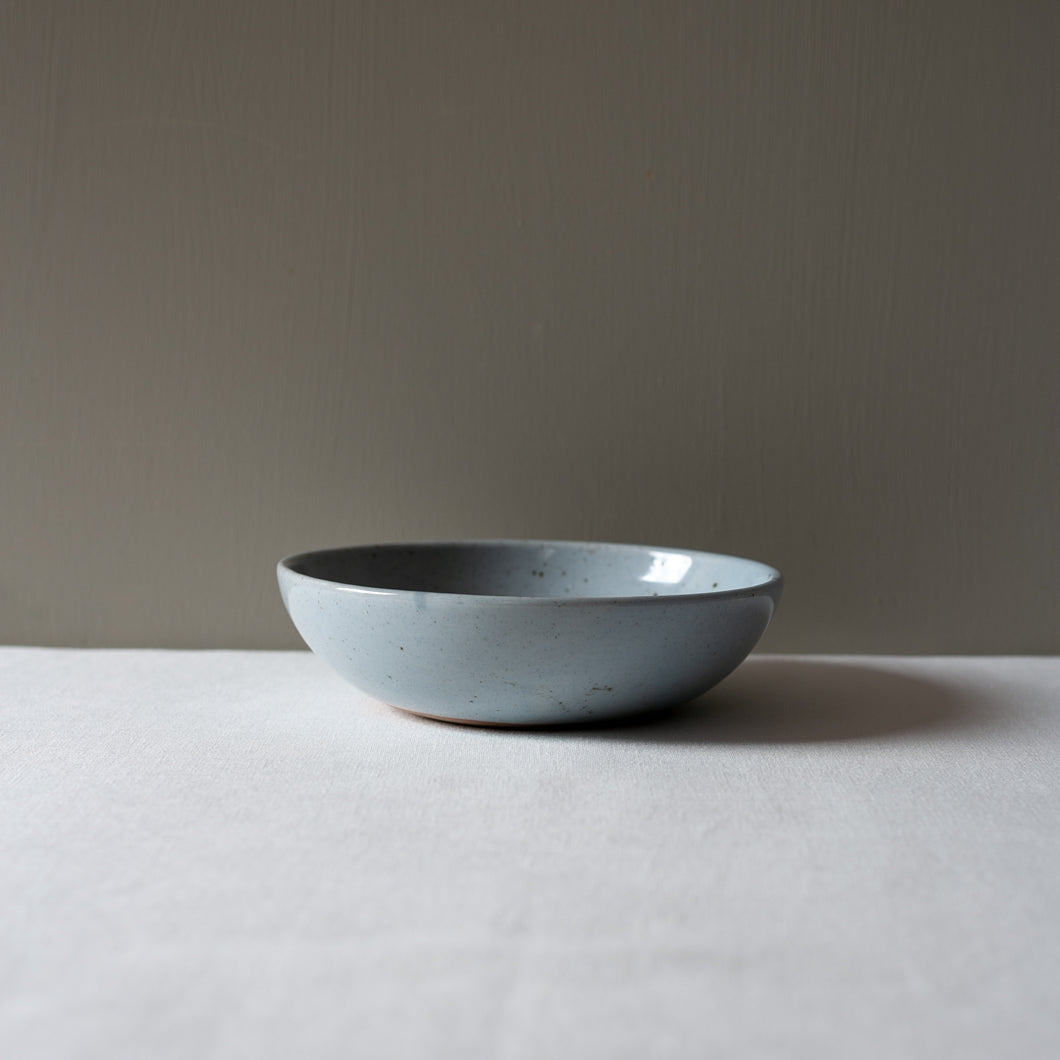 side view of Palinopsia's Ceramics handmade blue speckle breakfast bowl 