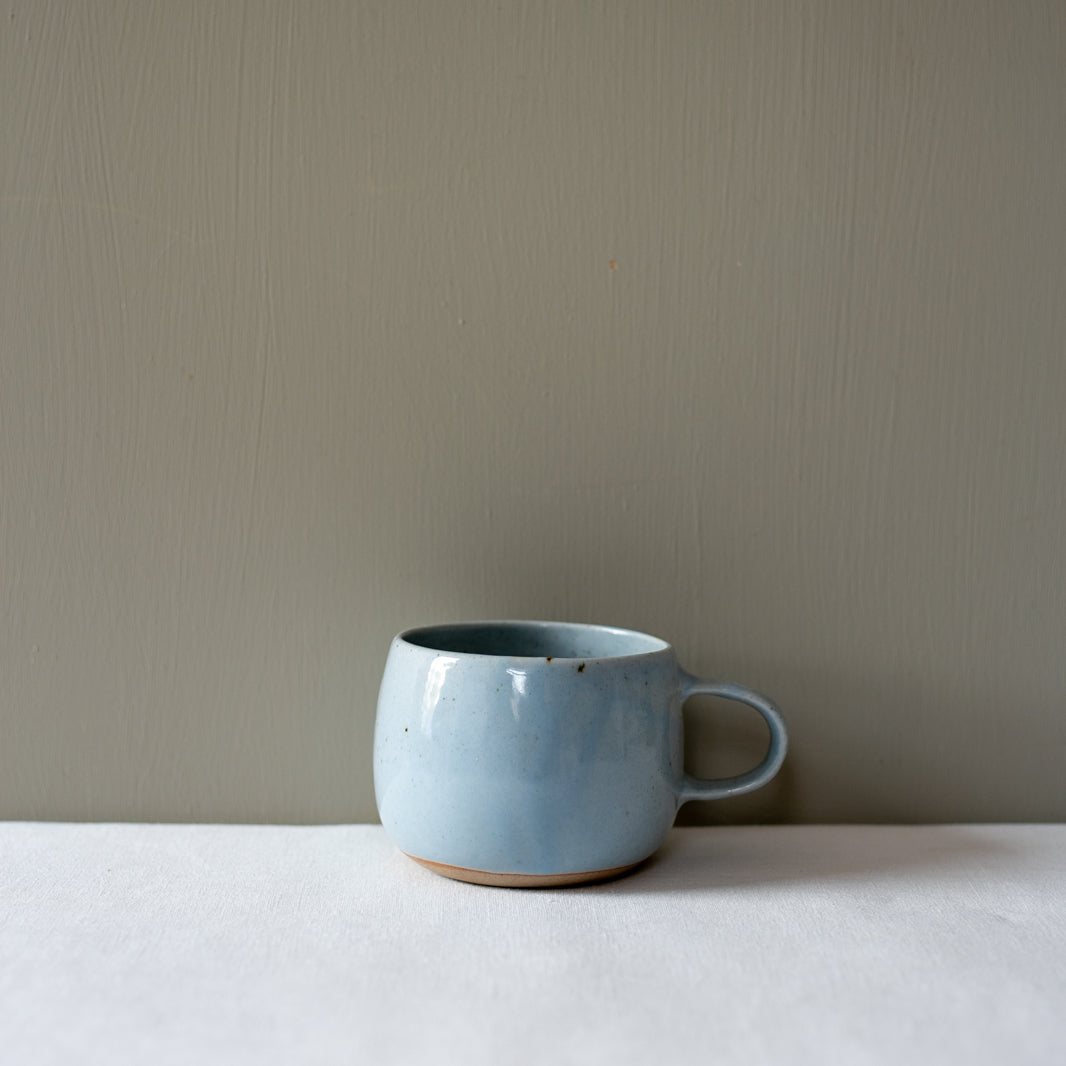 One handmade blue speckle coffee and tea hug mug by Palinopsia Ceramics  