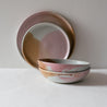 Stacked handmade bowls by Palinopsia Ceramics against a white background 